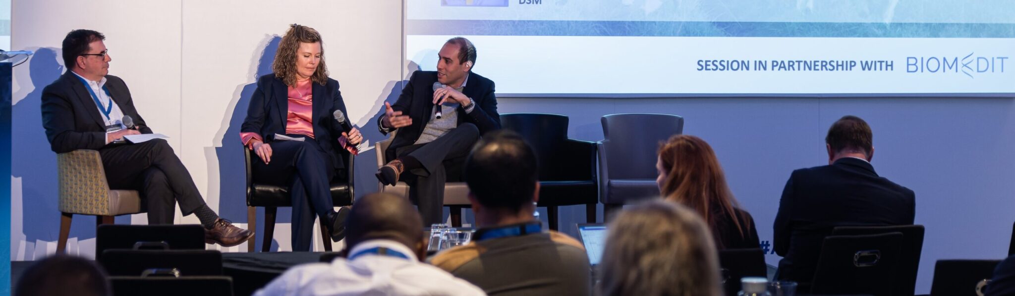 Aaron Schacht speaking on an industry panel at AHNTI Europe